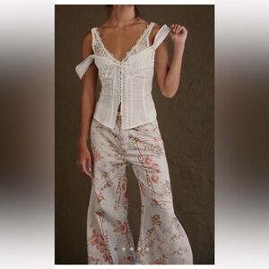 FREE PEOPLE WE THE FREE EDEN HIGH SLOUCHY PRINTED FLARE JEANS PANTS SZ 32S NWT.